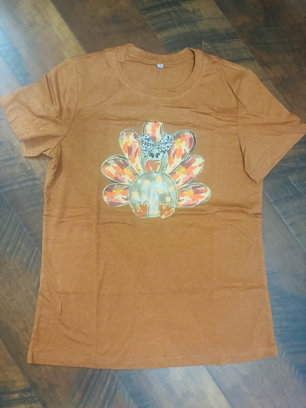 Women's Medium T-shirt w/ a cute watercolor-style turkey graphic w/ Cute Bow